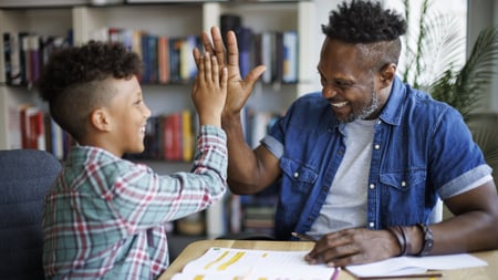 Teacher helping student with homework