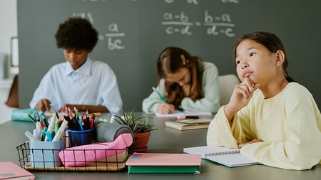 students doing assignments in a classroom