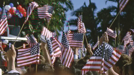 Flags waving at Presidents Day parade