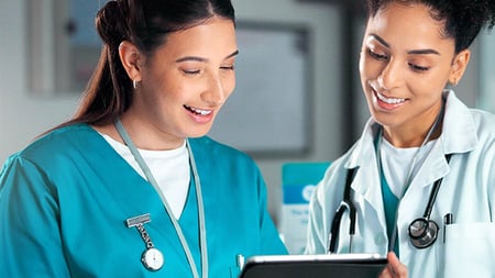 two people in scrubs