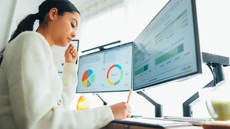 Woman working at standing desk home office