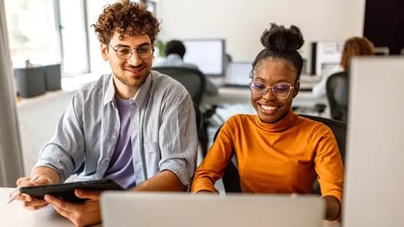 computer science professionals collaborating on a computer