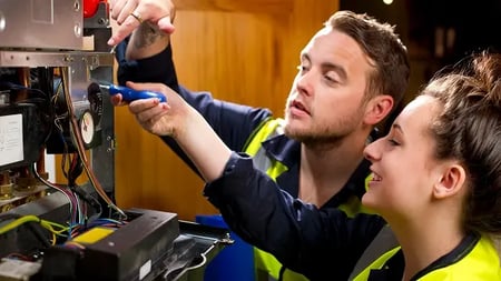 plumbing and electrical service technicians performing maintenance