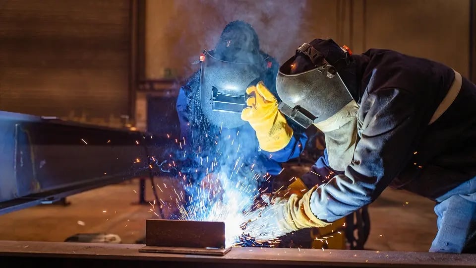 apprentice welder learning the trade
