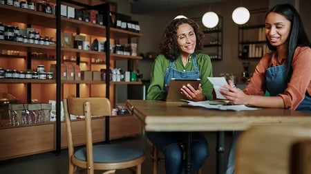 coworkers at a specialty food store having a conversation
