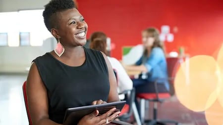 Confident female designer holding a tablet