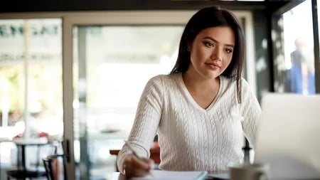 Woman working comfortably at a cafe