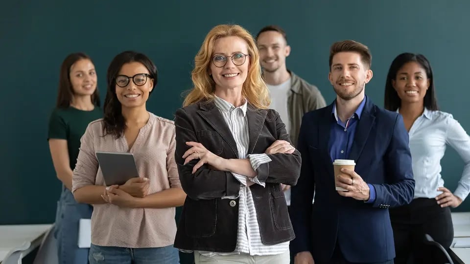 diverse business team leader posing with multiethnic group of employees