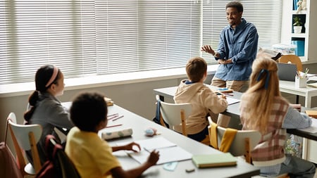 teacher and students in a classroom