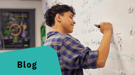 Teen practicing science problems confidently on board.