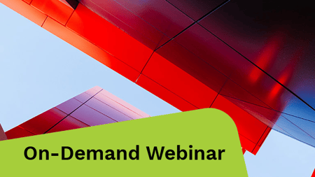 Low-angle shot in between two tall buildings.