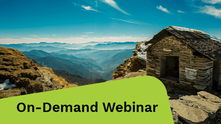 Brown wooden house on a mountain cliff.
