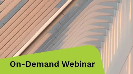 A ceiling view with a light casting a warm glow, revealing the building's architectural features.