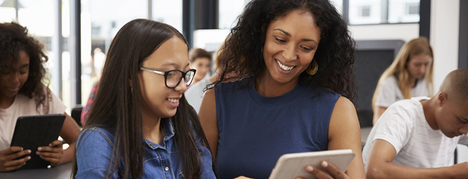 Two ladies looking at an iPad